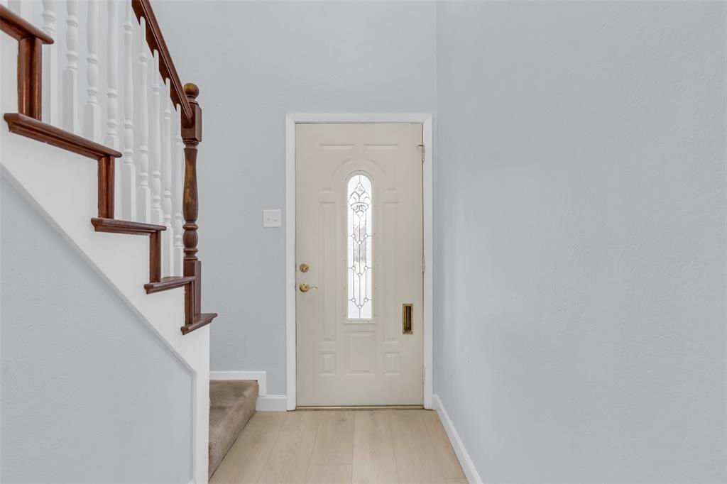 7610 Highmont Street Dallas, TX 75230 - Photo 4 of 37 a view of a hallway view with staircase