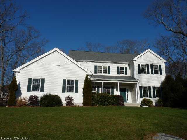 4 Taylor Ridge Road Clinton, CT 06413 - Photo 1 of 1 a front view of a house with a garden