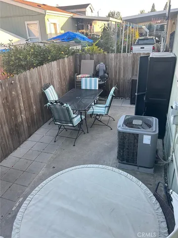 a view of a backyard with sitting area