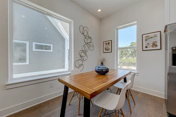 a view of a room that has a table and chairs in it