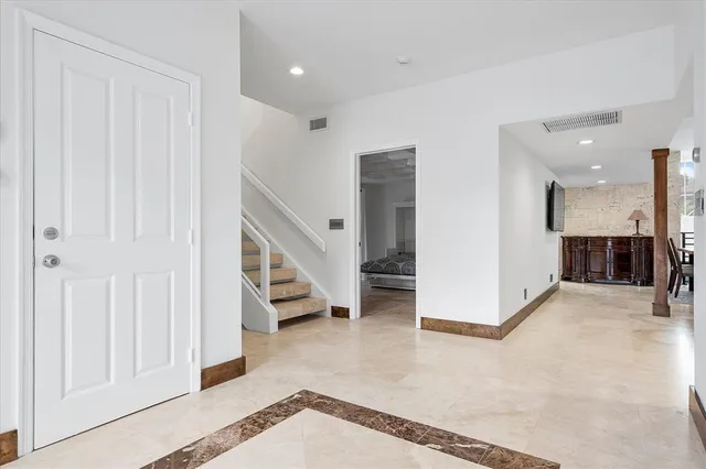 a kitchen with a stove a sink and a refrigerator