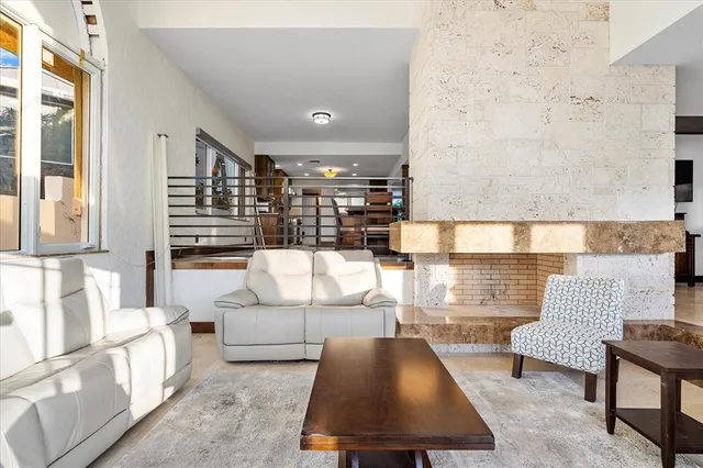 a bathroom with a granite countertop sink and shower