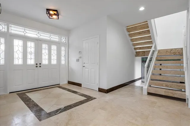 a front view of a house with swimming pool and porch