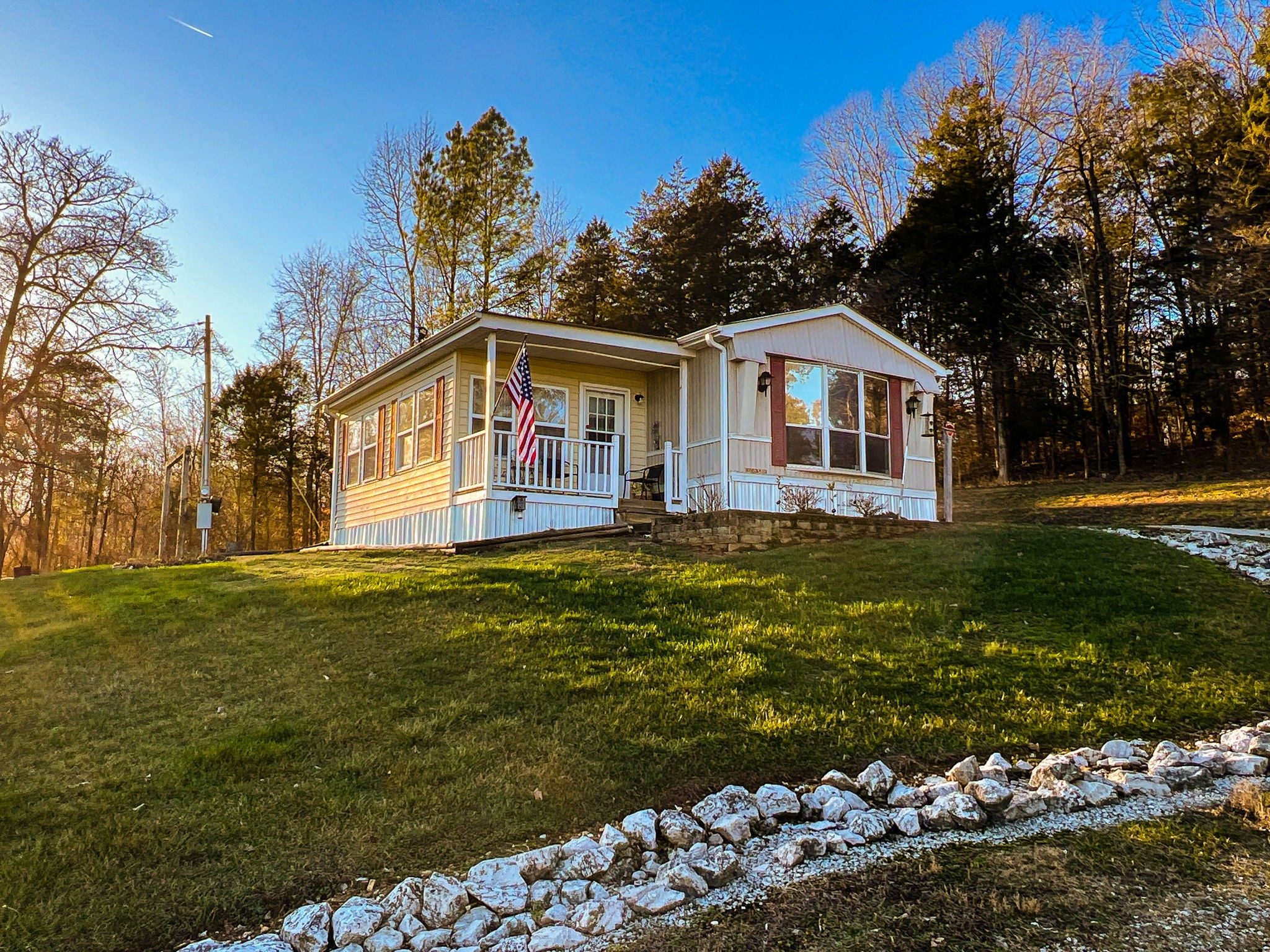 7925 Tom Patton Road Lyles, TN 37098 - Photo 40 of 68 a front view of a house with a garden