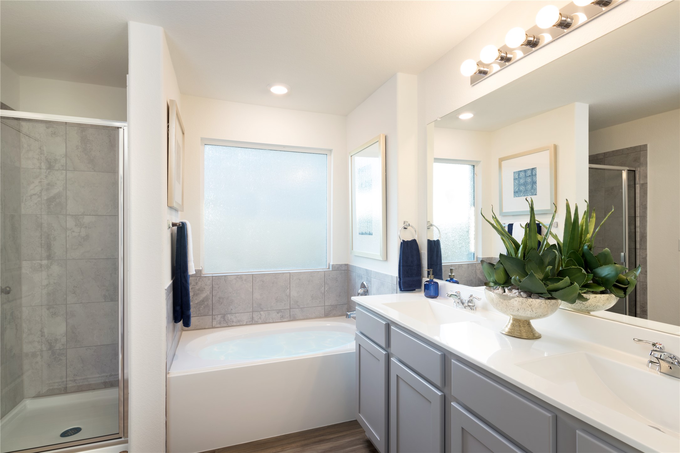 205 Parsons Kyle, TX 78640 - Photo 19 of 19 a bathroom with a tub sink and mirror