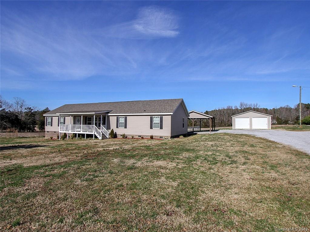 4027 Pink Plyler Road Lancaster, SC 29720 - Photo 1 of 34 a house view with a garden space