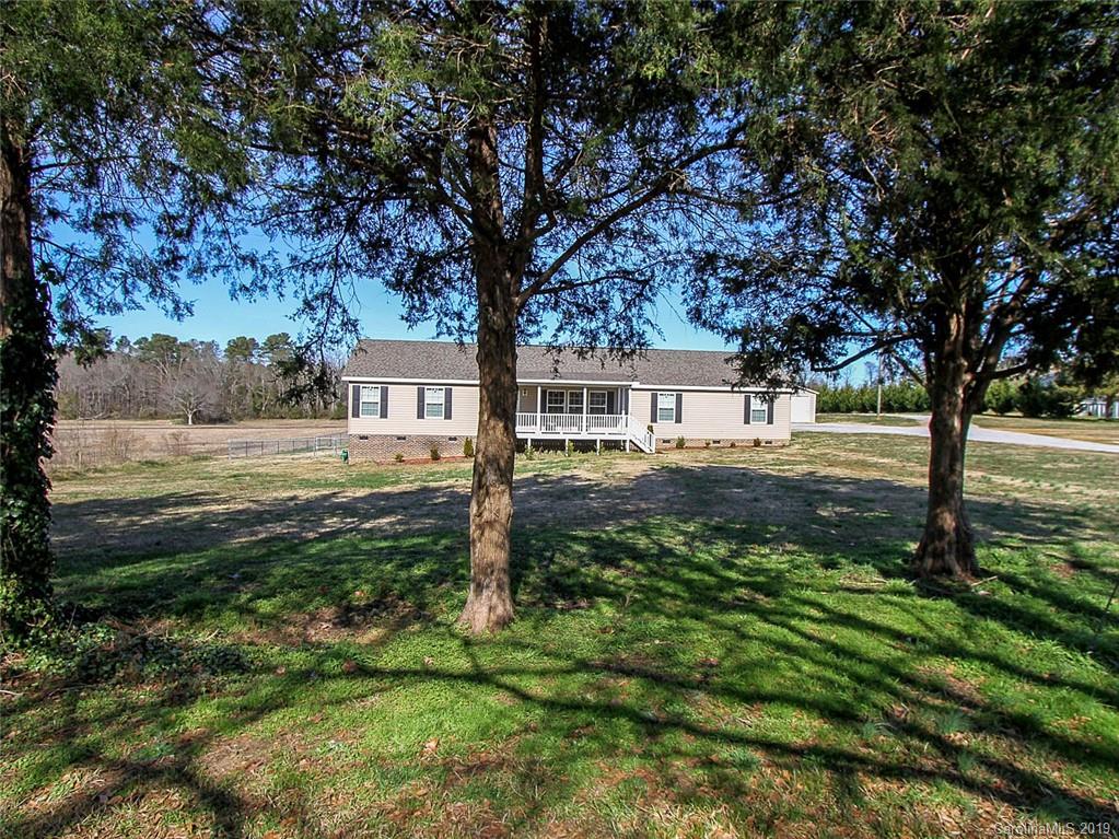4027 Pink Plyler Road Lancaster, SC 29720 - Photo 2 of 34 a view of a yard with plants and trees