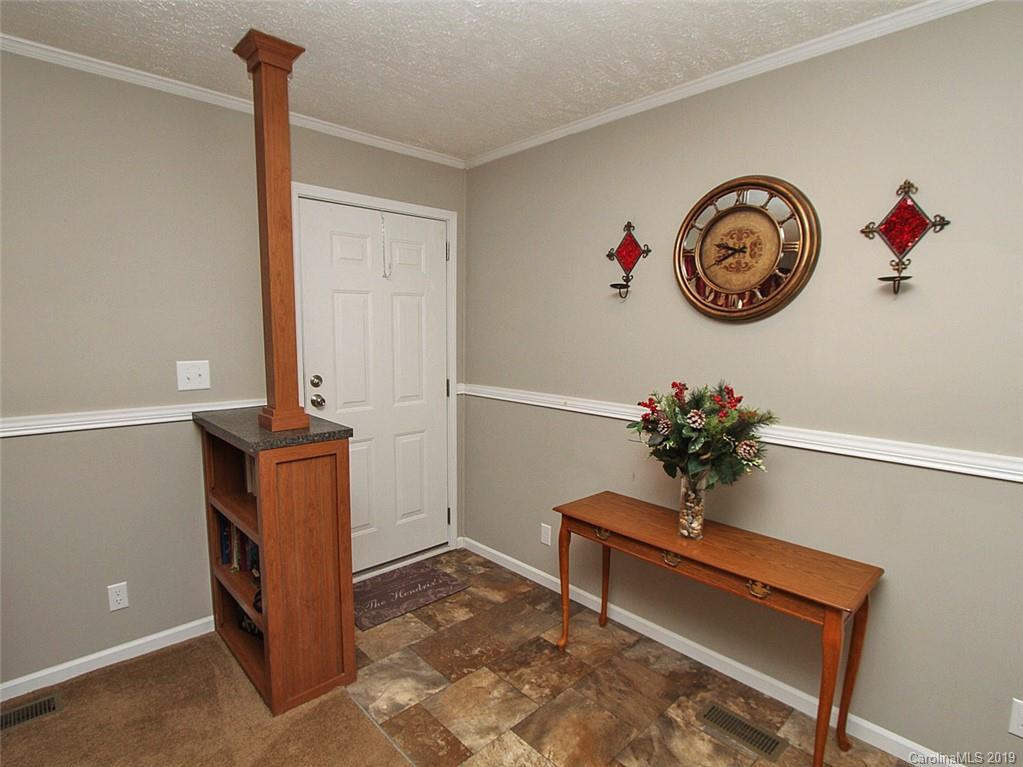 4027 Pink Plyler Road Lancaster, SC 29720 - Photo 15 of 34 a view of dining room with stairs and furniture