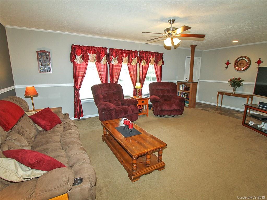 4027 Pink Plyler Road Lancaster, SC 29720 - Photo 17 of 34 a living room with furniture and a large window