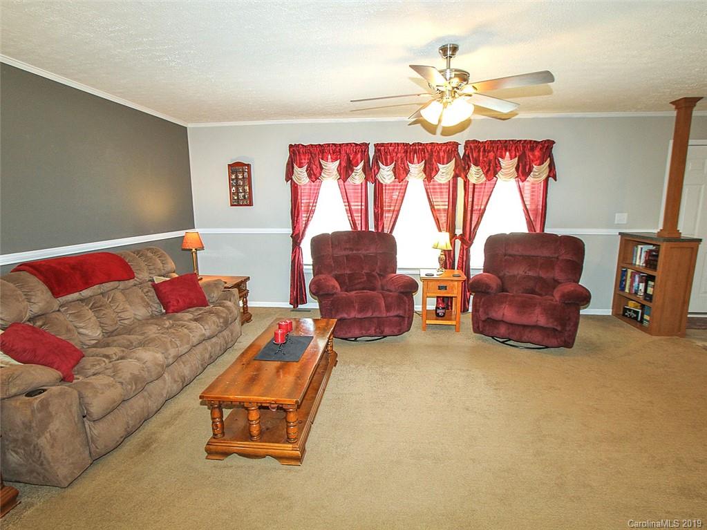 4027 Pink Plyler Road Lancaster, SC 29720 - Photo 18 of 34 a living room with furniture and a large window
