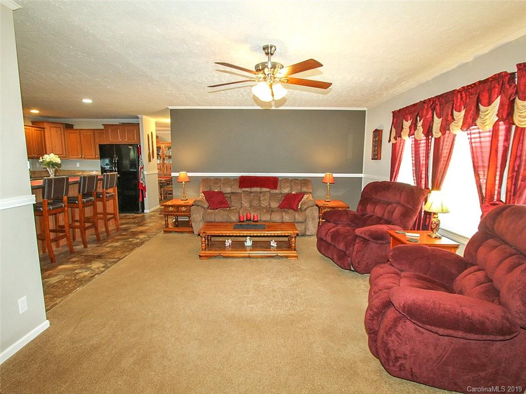 4027 Pink Plyler Road Lancaster, SC 29720 - Photo 19 of 34 a living room with furniture and a window