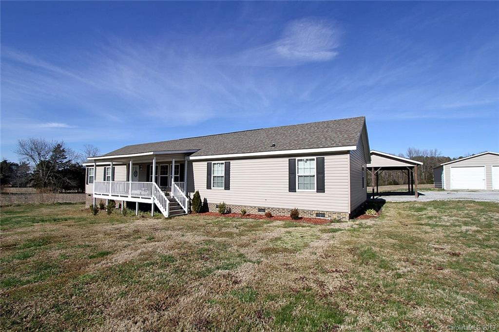 4027 Pink Plyler Road Lancaster, SC 29720 - Photo 3 of 34 a house view with a sitting space and garden