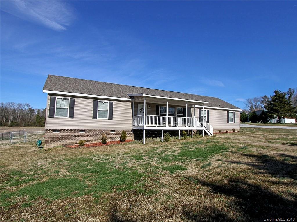 4027 Pink Plyler Road Lancaster, SC 29720 - Photo 5 of 34 a front view of a house with a yard