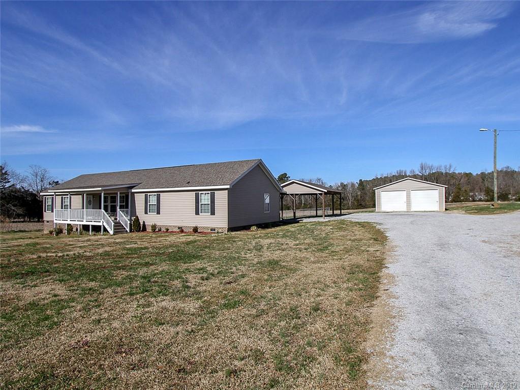 4027 Pink Plyler Road Lancaster, SC 29720 - Photo 7 of 34 a front view of a house with a yard