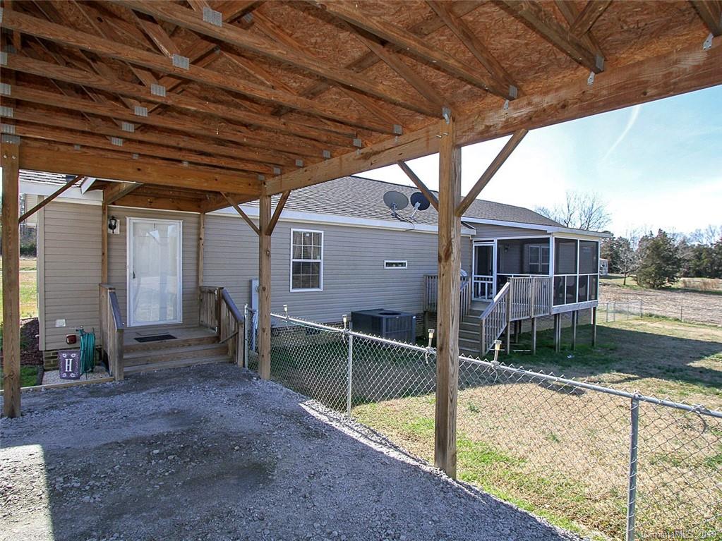 4027 Pink Plyler Road Lancaster, SC 29720 - Photo 10 of 34 a view of house with a big yard