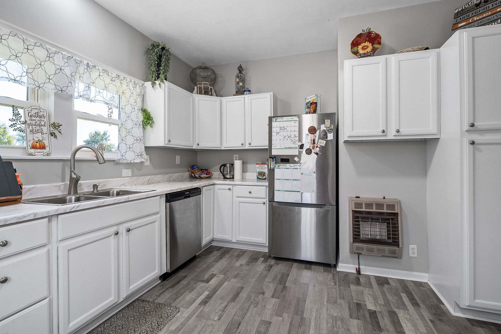 412 3rd Avenue North Baxter, TN 38544 - Photo 12 of 32 a kitchen with stainless steel appliances granite countertop a refrigerator sink and stove