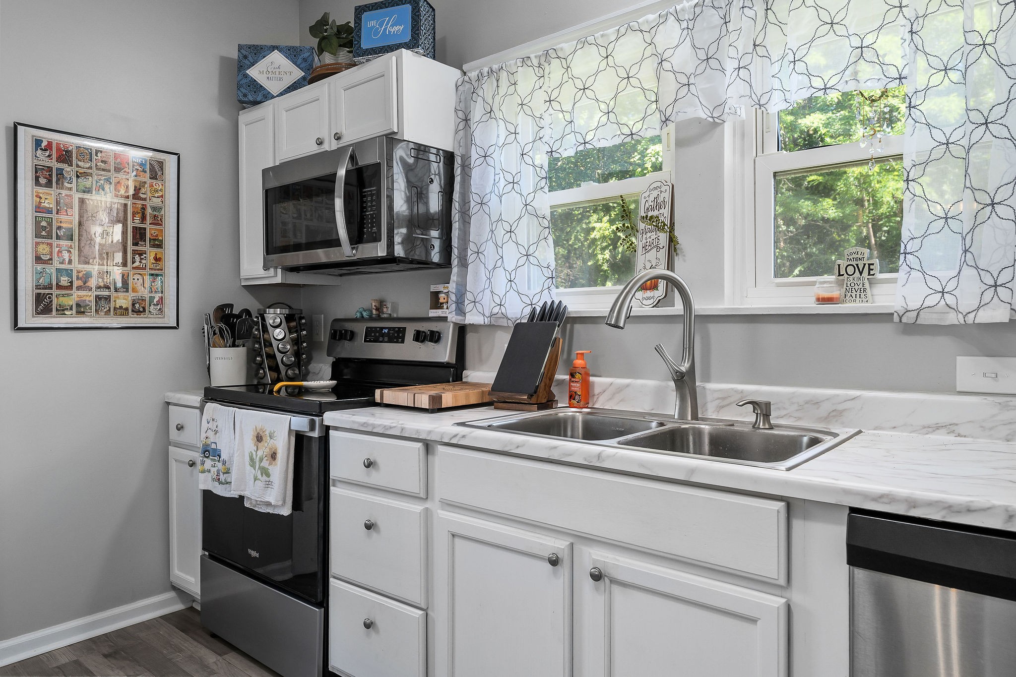 412 3rd Avenue North Baxter, TN 38544 - Photo 13 of 32 a kitchen with stainless steel appliances a sink a stove and a window