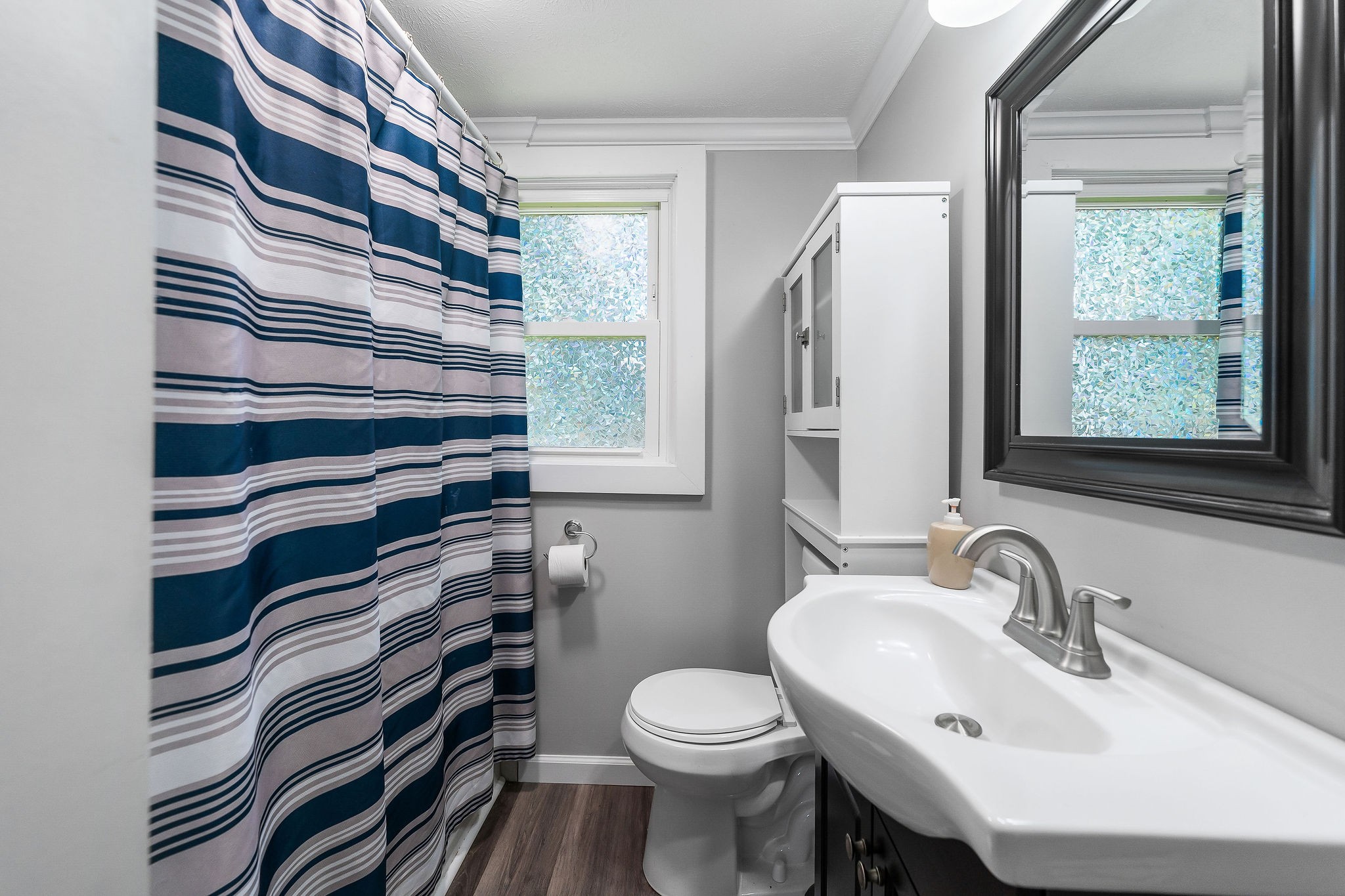 412 3rd Avenue North Baxter, TN 38544 - Photo 20 of 32 a bathroom with a sink a toilet and a mirror