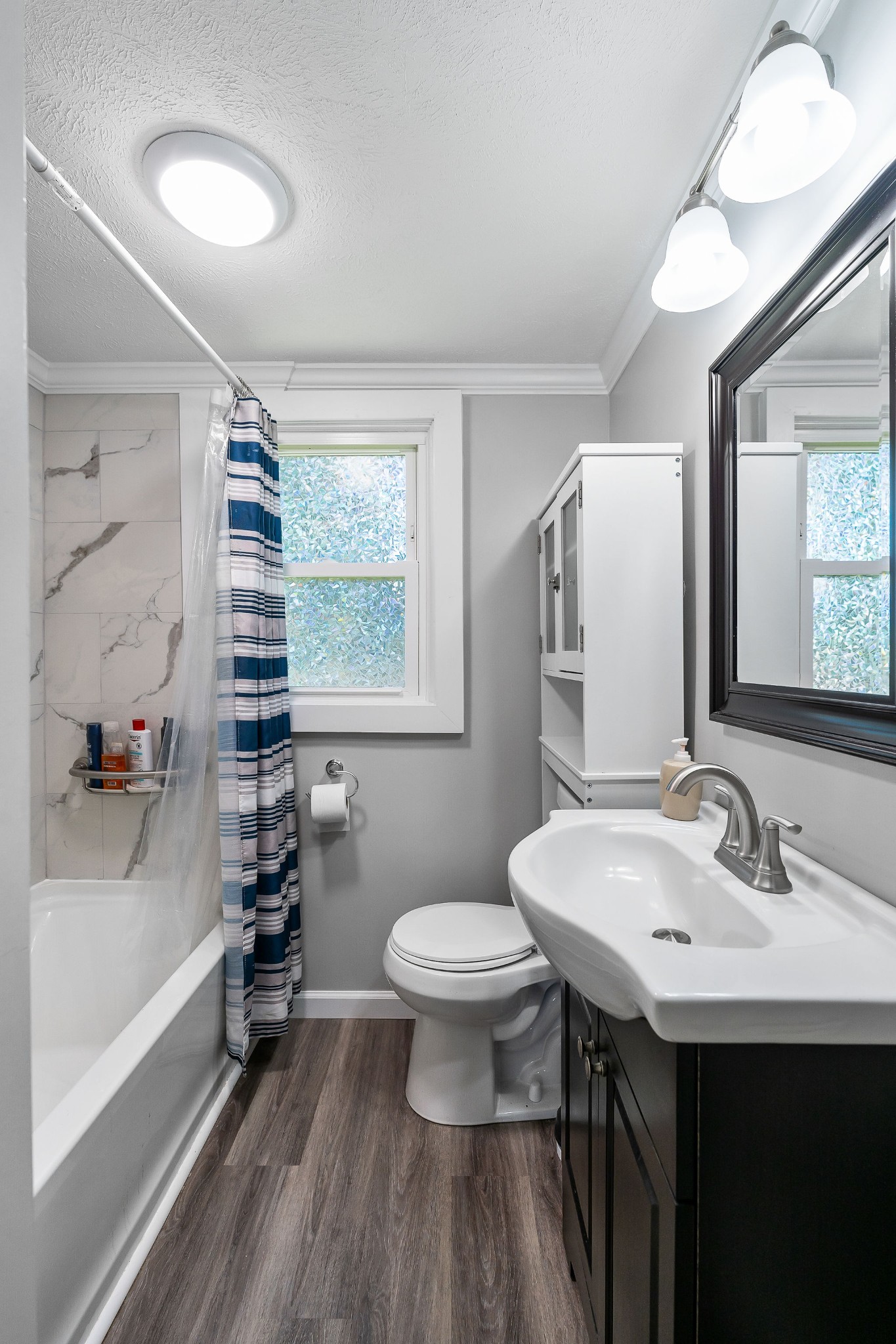 412 3rd Avenue North Baxter, TN 38544 - Photo 21 of 32 a bathroom with a sink toilet and a mirror