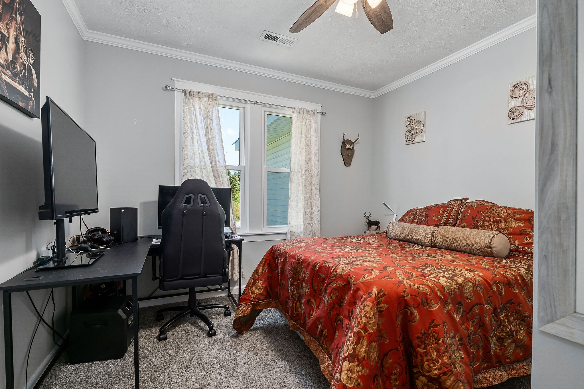 412 3rd Avenue North Baxter, TN 38544 - Photo 22 of 32 a bedroom with a bed and a chandelier