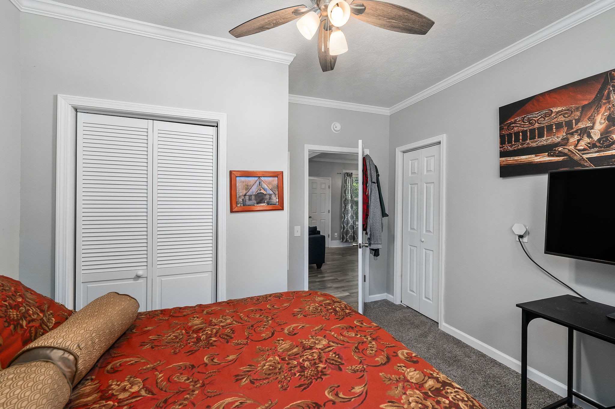 412 3rd Avenue North Baxter, TN 38544 - Photo 23 of 32 a bedroom with a bed and a flat screen tv