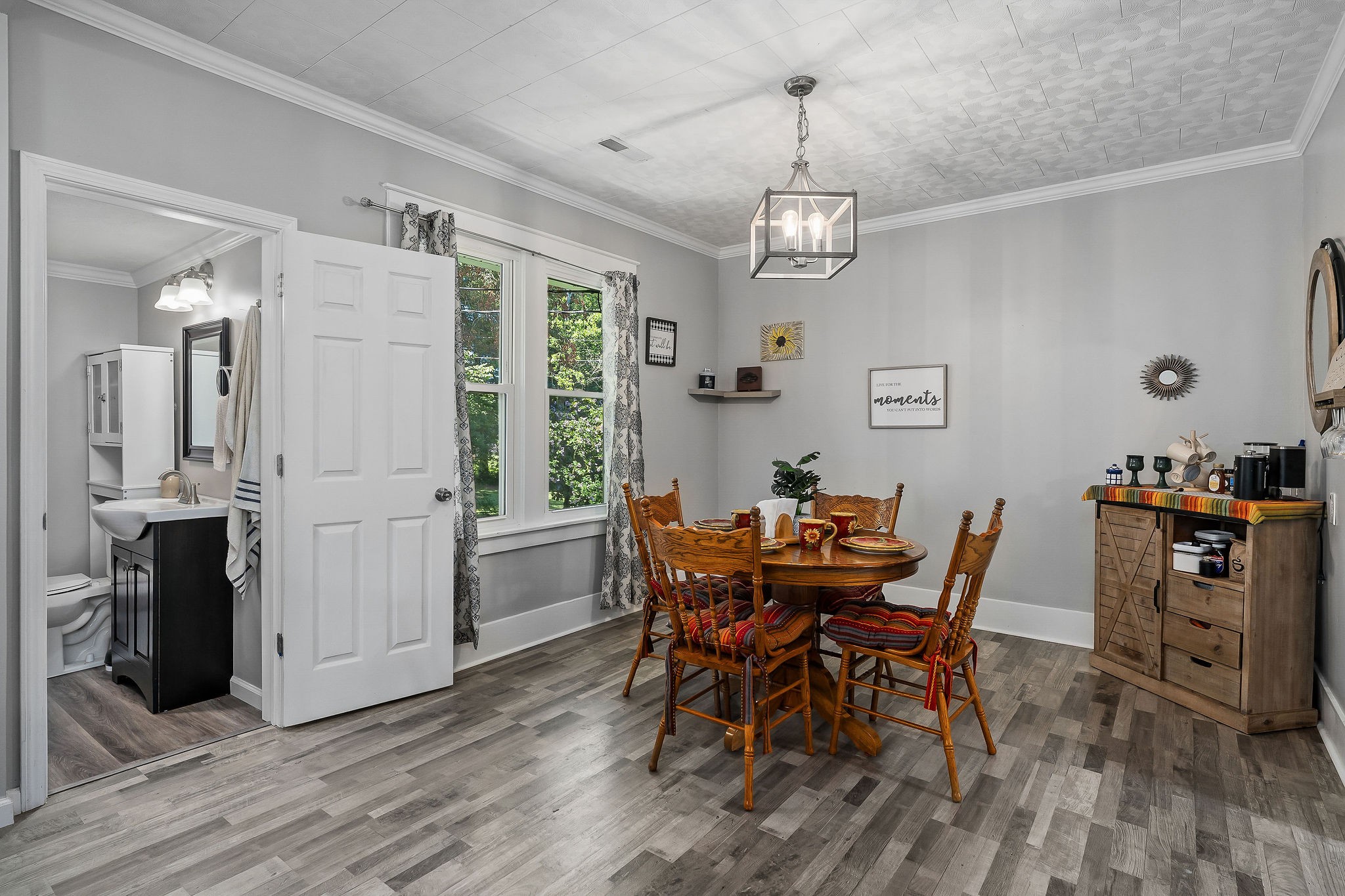 412 3rd Avenue North Baxter, TN 38544 - Photo 9 of 32 a view of a dining room with furniture and wooden floor