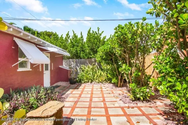 a view of a chairs and table in the patio