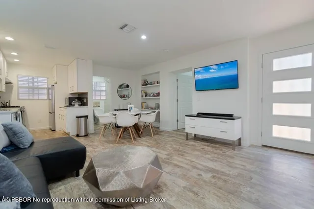 a view of a dining room with furniture and wooden floor