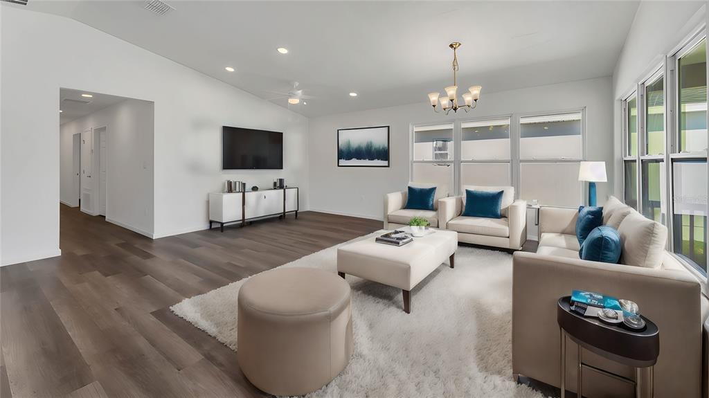 1040 20th Street Orlando, FL 32805 - Photo 11 of 33 a living room with furniture and a flat screen tv