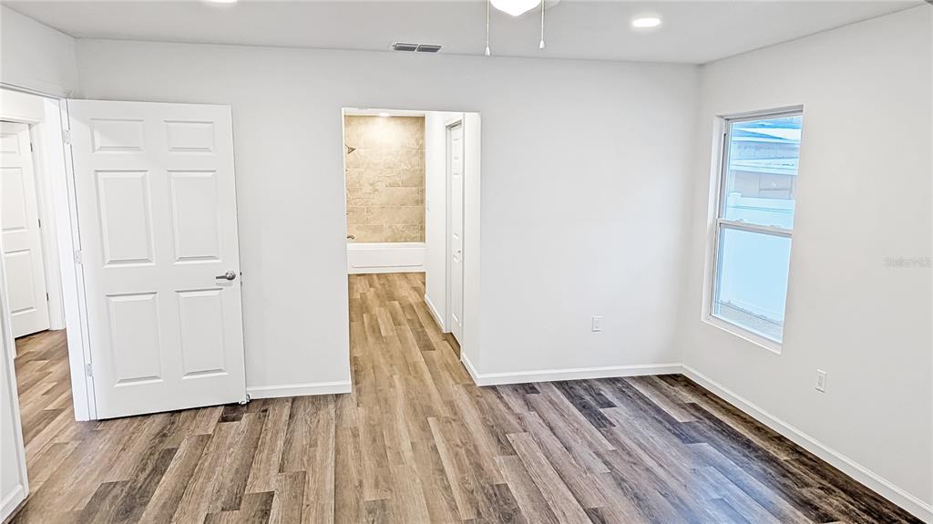 1040 20th Street Orlando, FL 32805 - Photo 13 of 33 wooden floor in an empty room