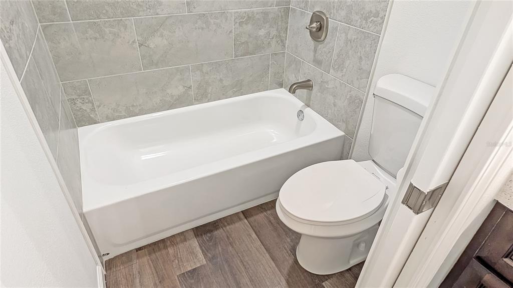 1040 20th Street Orlando, FL 32805 - Photo 20 of 33 a bathroom with a sink and a toilet