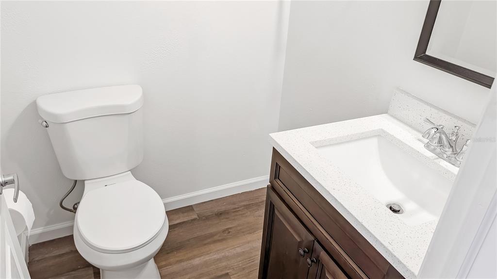 1040 20th Street Orlando, FL 32805 - Photo 22 of 33 a bathroom with a sink and a toilet