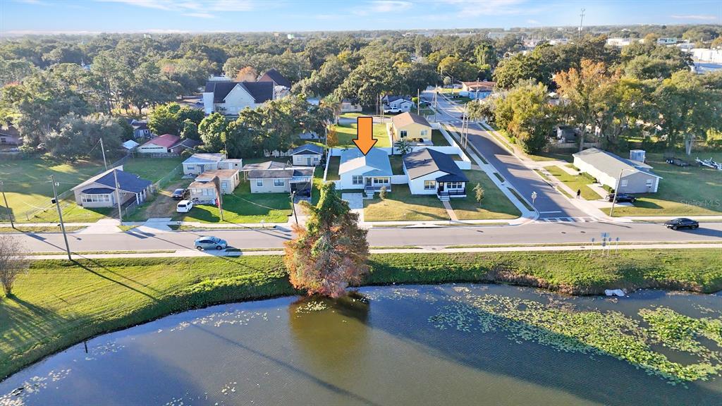 1040 20th Street Orlando, FL 32805 - Photo 30 of 33 an aerial view of a house with a garden and lake view