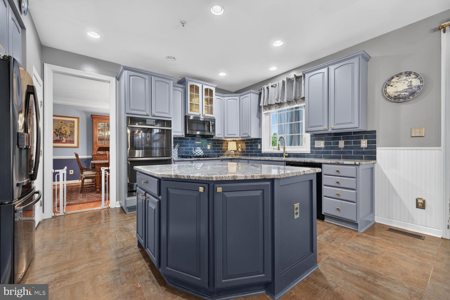23106 Birch Mead Road Clarksburg, MD 20871 - Photo 2 of 60 a kitchen with kitchen island granite countertop a stove top oven a refrigerator a sink and dishwasher