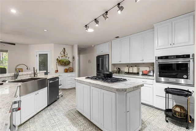 a view of a livingroom with workspace and a couch
