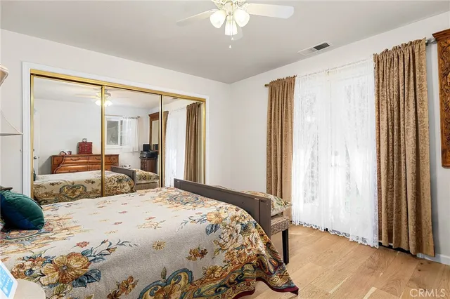 a bathroom with a sink mirror vanity and toilet