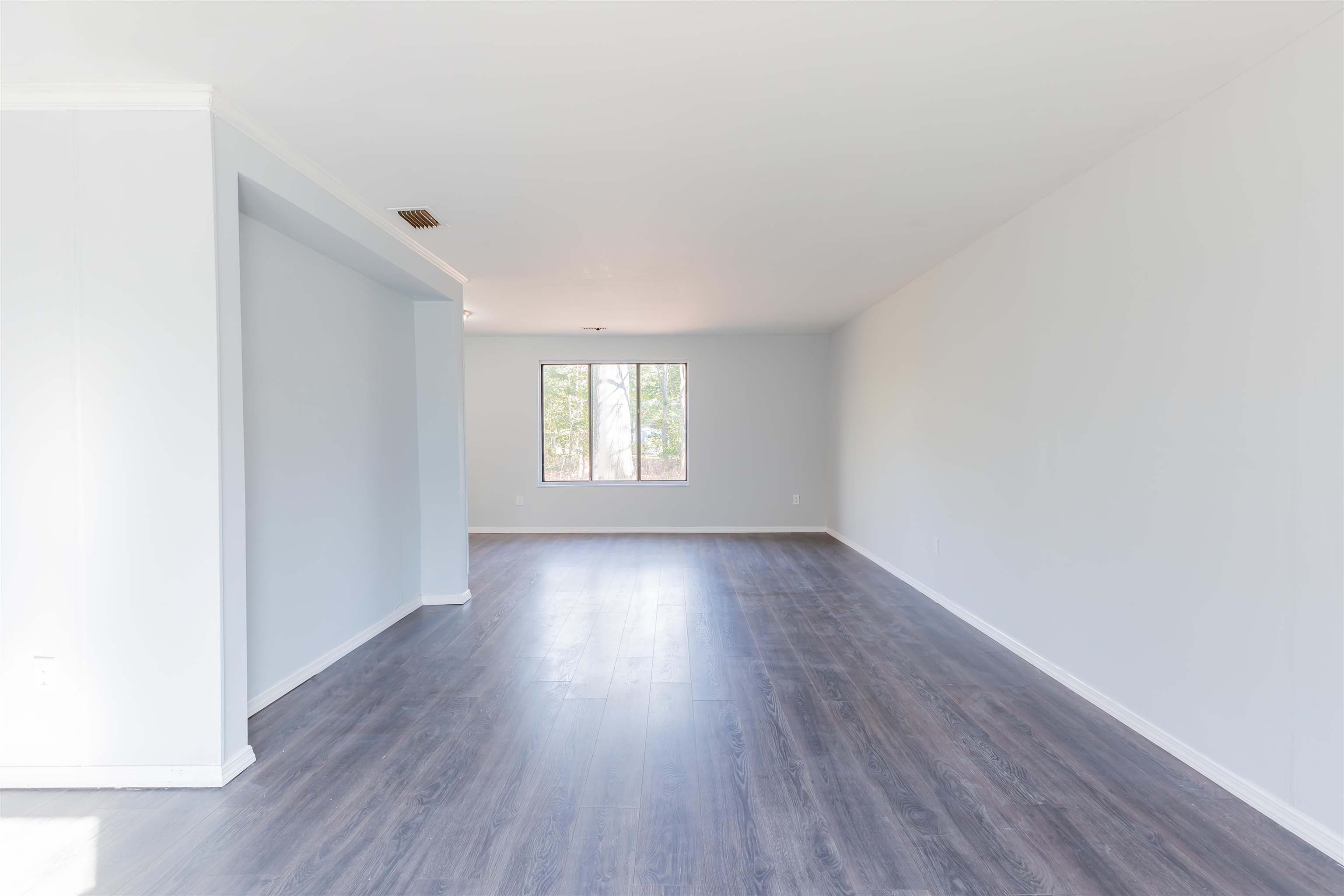 504 East Main Street Rio Grande, NJ 08242 - Photo 3 of 22 a view of an empty room with wooden floor and window