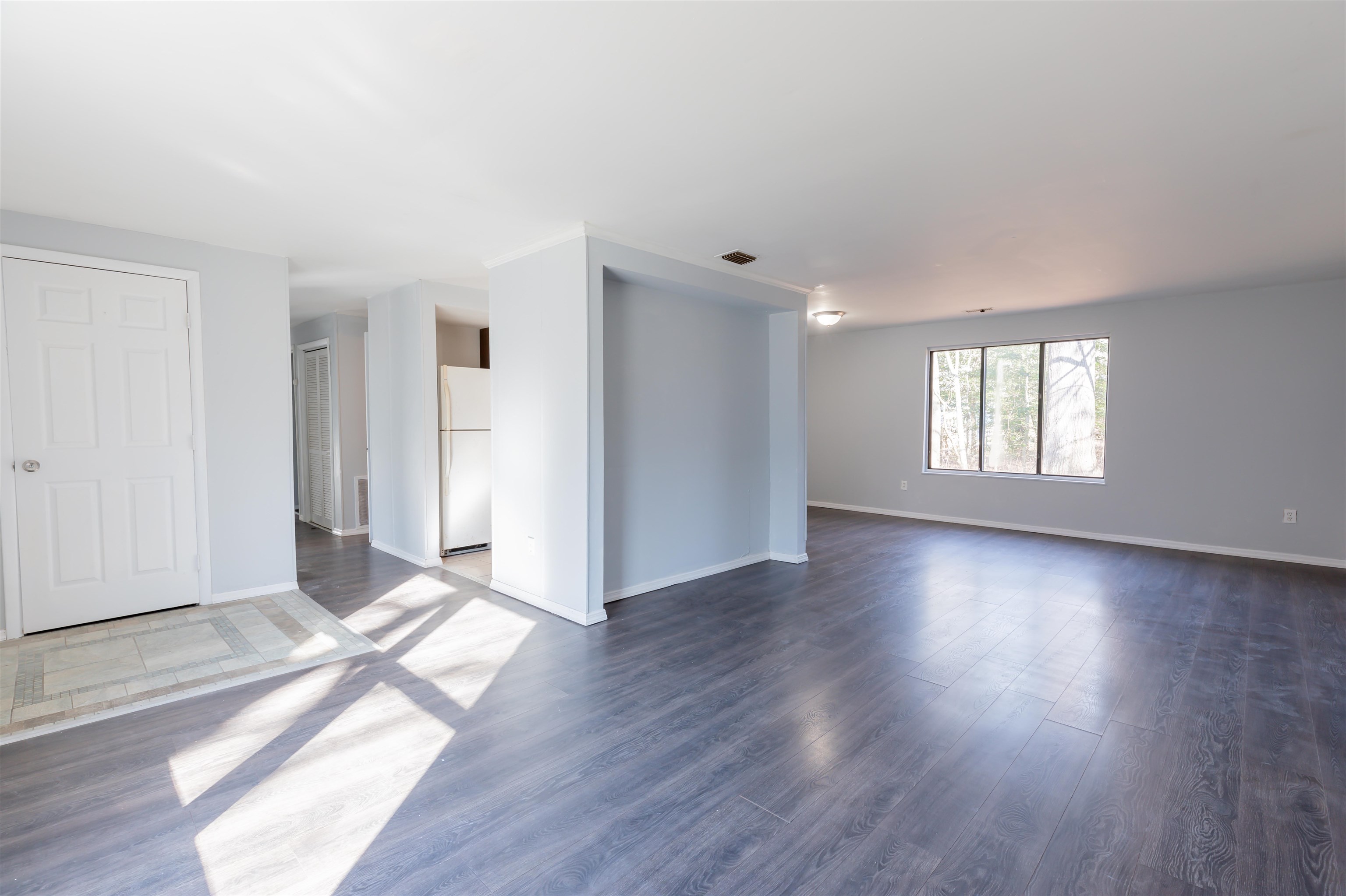 504 East Main Street Rio Grande, NJ 08242 - Photo 4 of 22 an empty room with wooden floor and windows