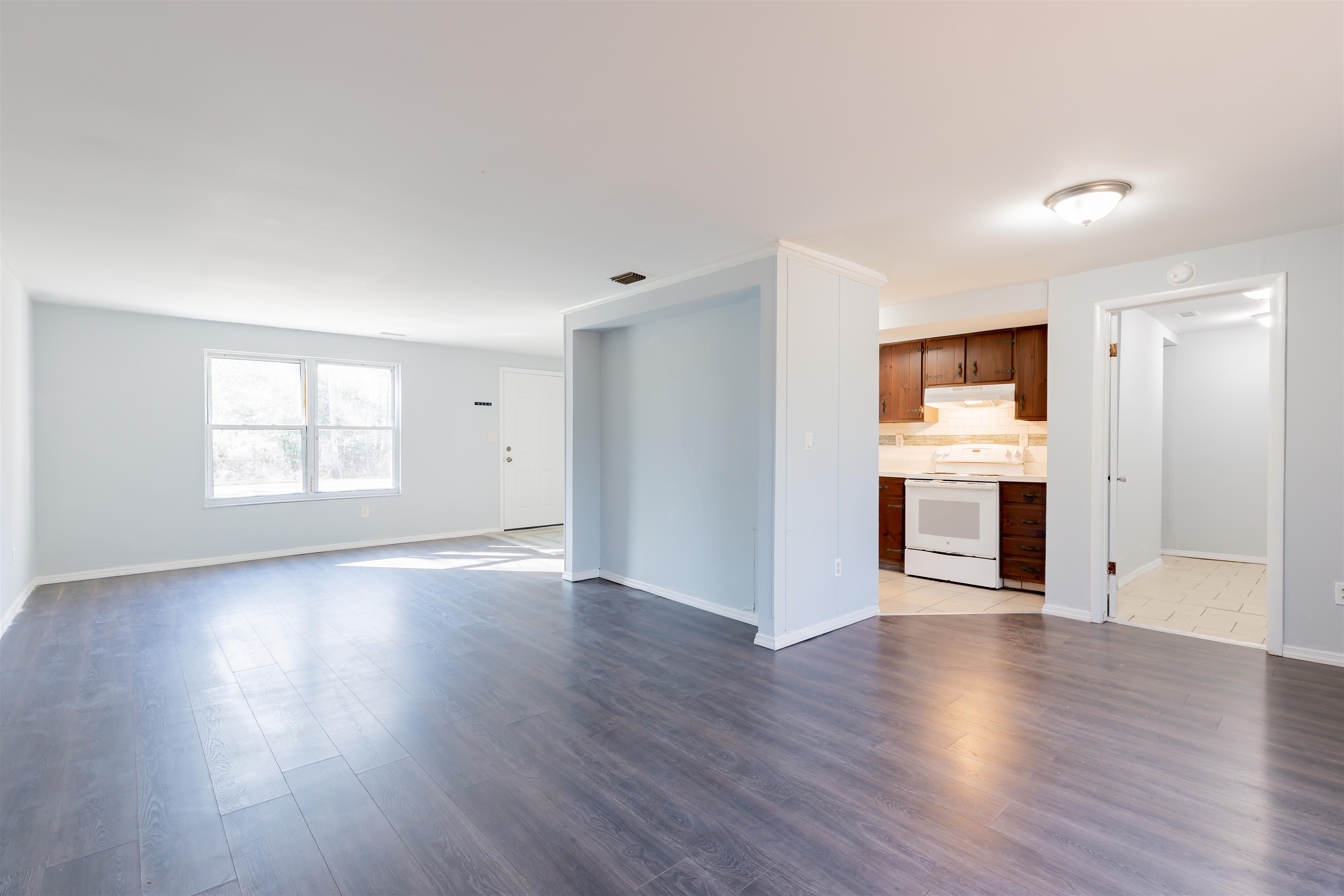 504 East Main Street Rio Grande, NJ 08242 - Photo 5 of 22 a view of a livingroom with wooden floor a fireplace and window