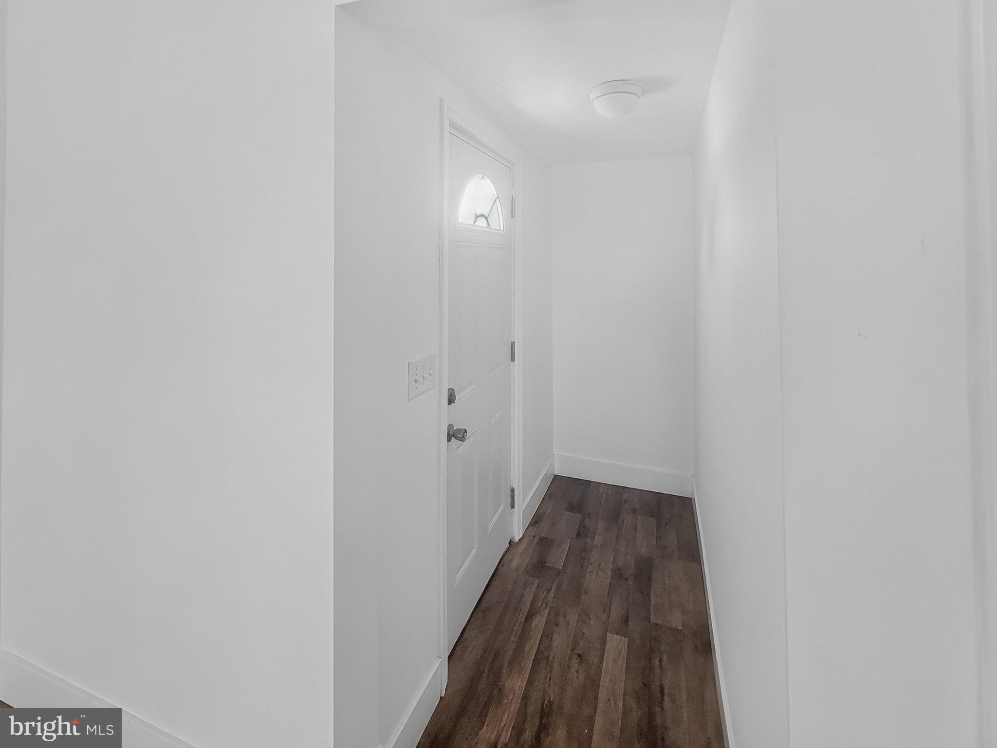 4658 White Marsh Road Madison, MD 21648 - Photo 18 of 25 a view of a hallway with wooden floor