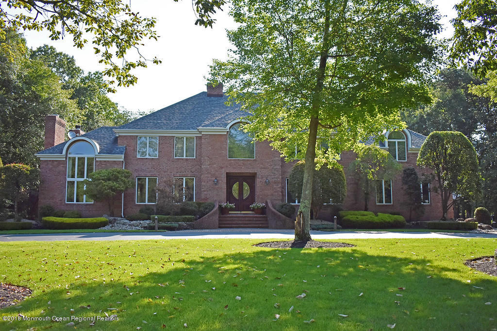 19 Russell Road Freehold, NJ 07728 - Photo 1 of 68 a front view of a house with garden