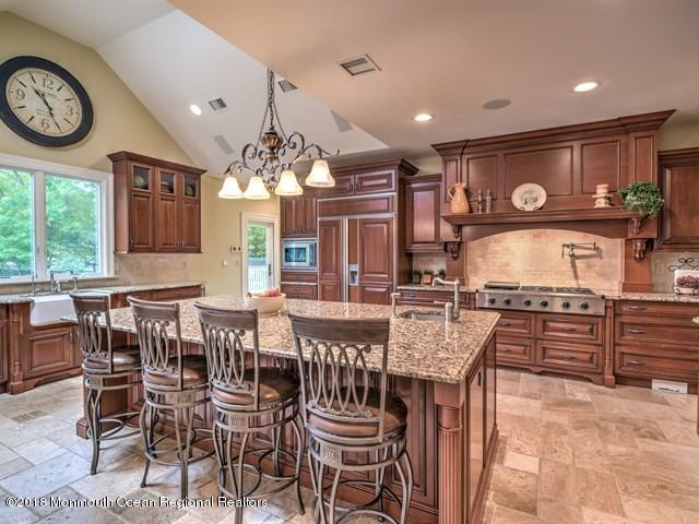 19 Russell Road Freehold, NJ 07728 - Photo 14 of 68 a view of a dining room with furniture window and wooden floor