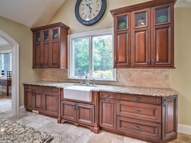 19 Russell Road Freehold, NJ 07728 - Photo 19 of 68 a kitchen with stainless steel appliances granite countertop a stove and a sink with granite countertops