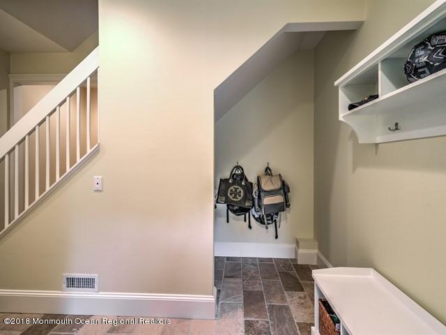 19 Russell Road Freehold, NJ 07728 - Photo 23 of 68 a view of a hallway with bathroom and mirror