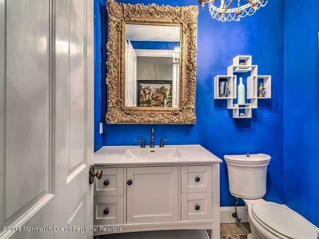19 Russell Road Freehold, NJ 07728 - Photo 24 of 68 a bathroom with a sink mirror and toilet
