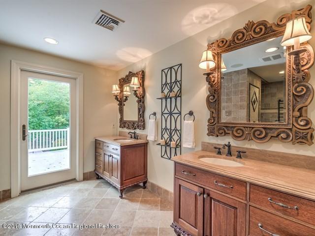 19 Russell Road Freehold, NJ 07728 - Photo 27 of 68 a kitchen with stainless steel appliances granite countertop a stove and a sink