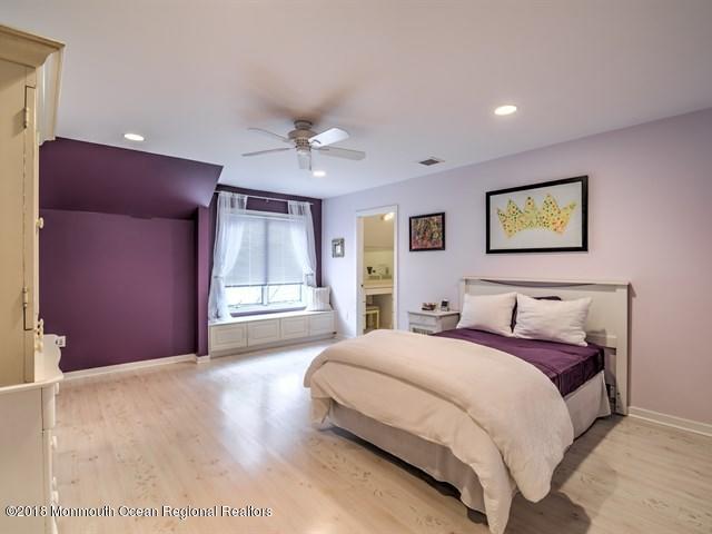 19 Russell Road Freehold, NJ 07728 - Photo 32 of 68 a spacious bedroom with a large bed and a window