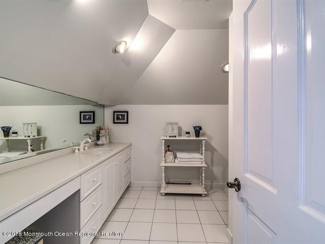 19 Russell Road Freehold, NJ 07728 - Photo 33 of 68 a spacious bathroom with a sink a toilet and mirror