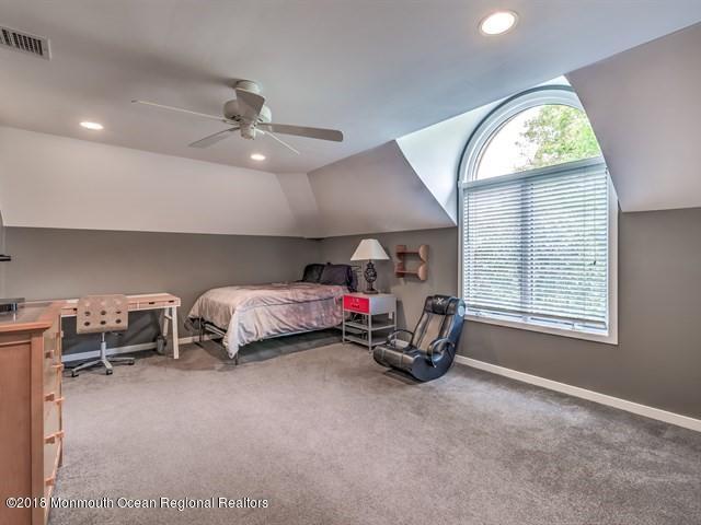 19 Russell Road Freehold, NJ 07728 - Photo 34 of 68 a view of a bedroom with furniture a ceiling fan and a window