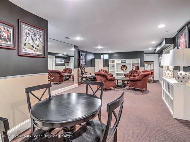 19 Russell Road Freehold, NJ 07728 - Photo 38 of 68 a living room with furniture and a chandelier